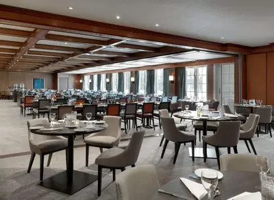 a large dining room with tables and chairs at Scandic Lillehammer Hotel in Lillehammer