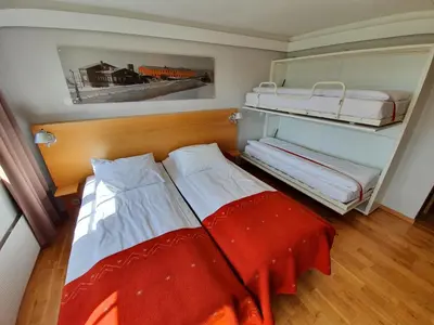 a small room with two bunk beds in it at Røros Hotell - Bad & Velvære in Røros