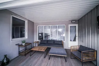a living room with a couch and a table at Villa Vågå - by Classic Norway Hotels in Vågåmo