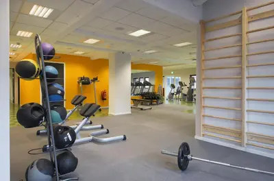 a gym with weights and equipment in a room at Thon Hotel Hallingdal in Ål
