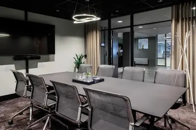 a conference room with a large table and chairs at Quality Hotel Strand Gjøvik in Gjøvik