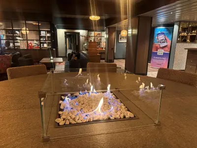 a fire pit on a table in a room at Skogstad Hotel - Unike Hoteller in Hemsedal