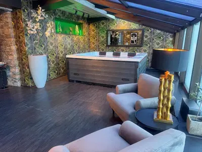 a living room with a couch and a dresser at Skogstad Hotel - Unike Hoteller in Hemsedal