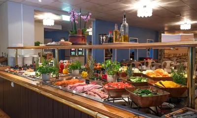 a buffet line with many different types of food at Thon Hotel Skeikampen in Svingvoll