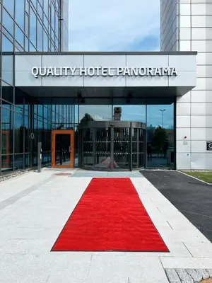 a red carpet in front of a hotel with a building at Quality Hotel Panorama in Trondheim