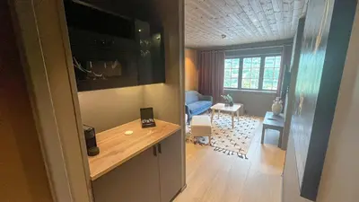a small living room with a table and a living room at Trysil-Knut Hotel in Trysil
