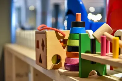 a group of wooden toys sitting on a counter at Thon Hotel Central in Elverum