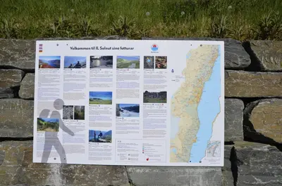 a interpretive sign on a rock wall at Aga Fjord Apartments Hardanger in Nå