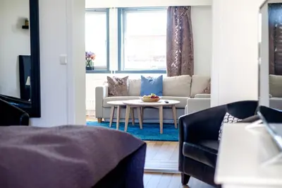 a living room with a couch and a table at Tynset Hotel in Tynset