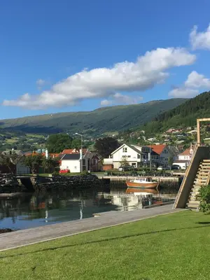 a small town next to a body of water at Blix Hotel in Vikøyri