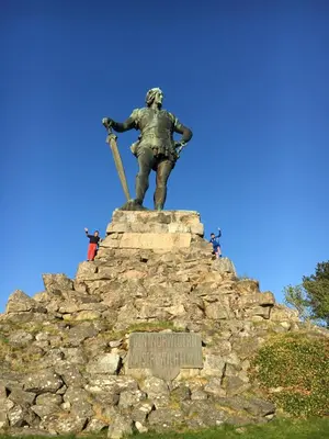 a statue of a soldier on top of a rock pile at Blix Hotel in Vikøyri