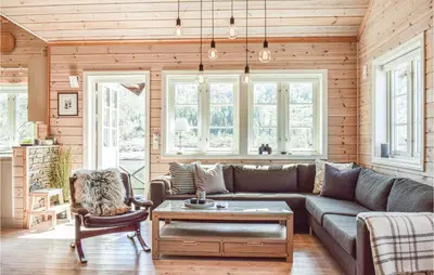 a living room with a couch and a table at Tokagjelet in Norheimsund