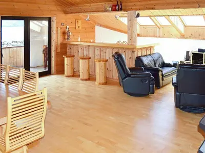 a living room with a table and chairs at 10 person holiday home in EIDSVÅG-By Traum in Rød