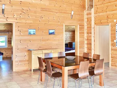 a dining room with a table and chairs at 6 person holiday home in EIDSVÅG-By Traum in Rød