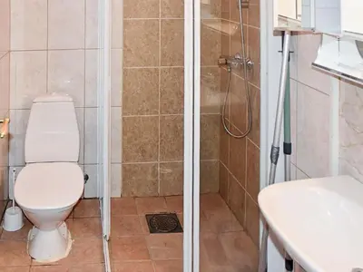 a bathroom with a shower and a toilet and a sink at 5 person holiday home in Selje-By Traum in Selje