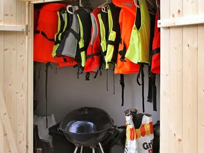 a bunch of clothes hanging in a closet at 6 person holiday home in Leirvik i Sogn-By Traum in Bø