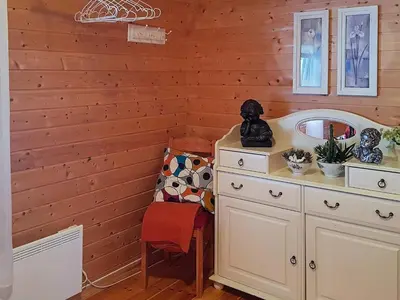 a room with a wooden wall with a basketball hoop at 8 person holiday home in Sundlandet in Snildal