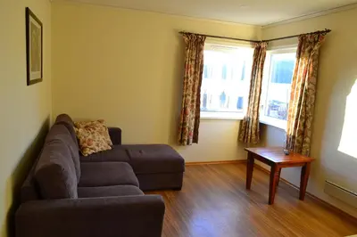a living room with a couch and a table at VIKEDAL VERTSHUS hotel in Vikedal