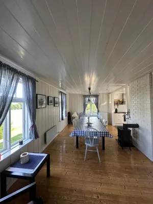 a dining room with a table in a tent at Idylliske Evjua ved Mjøsa in Skreia