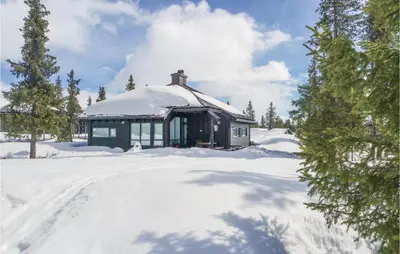a small building in the snow with snow covered trees at 3 Bedroom Stunning Home In Sjusjøen in Sjusjøen