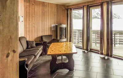 a living room with a couch and a table at Gorgeous Apartment In Hemsedal in Hemsedal