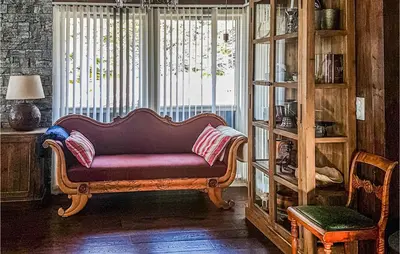 a couch sitting in a room with a window at Sjusjøen-Pihl 89 in Sjusjøen