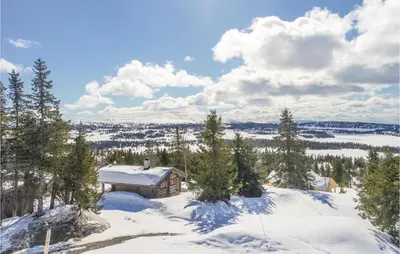 a cabin in the snow with a view of the city at Sjusjøen Pihl 4020 in Sjusjøen