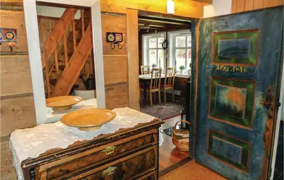 a kitchen with an old wooden door in a room at 2 Bedroom Awesome Home In Tørvikbygd in Tyrvikbygd