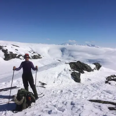 a person standing on top of a snow covered mountain at Jostedal Camping in Jostedal