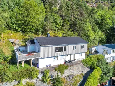 an aerial view of a house on a hill at City View Studio Apartment in Ålesund