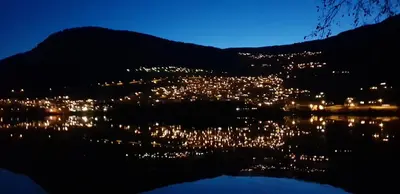 a view of a city lit up at night at Voss Interlake - Villa in Skulestadmo