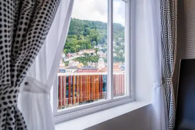 a window with a view of a city at Magic Kloverhuset Harbour Hotel, a member of Radisson Individuals in Bergen