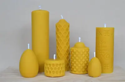 a group of yellow candles sitting on a table at Rongen gard in Bolstadøyri