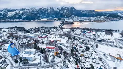 an aerial view of a city covered in snow at Namsos Hybelhus in Namsos