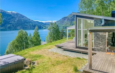 a house on a hill with a view of a lake at Nice Home In Ornes With House Sea View in Ornes