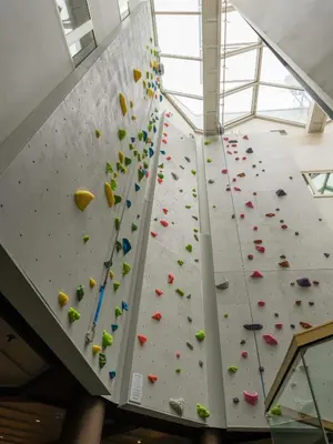 a large indoor climbing wall in a building at Scandic Hafjell in Hafjell