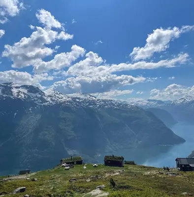 a hillside with a view of a mountain at Valldal Fjord Lodge B&B in Valldal