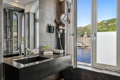 a bathroom with a sink and a window at Clarion Hotel Admiral in Bergen