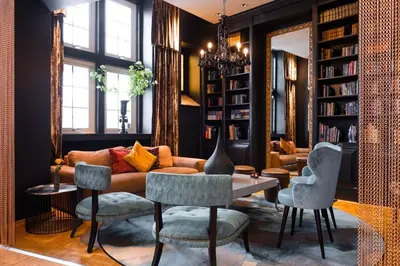 a living room with a couch and chairs at Home Hotel Havnekontoret in Bergen