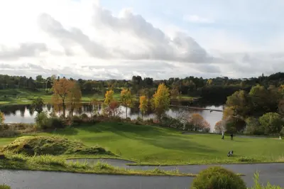 an aerial view of a golf course with a lake at Quality Hotel Edvard Grieg in Bergen