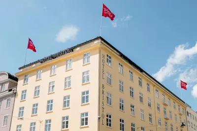a building with three flags on top of it at Thon Hotel Bristol, Bergen in Bergen
