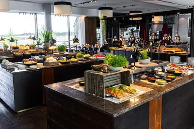 a buffet line with many different types of food at Clarion Hotel Bergen Airport in Bergen