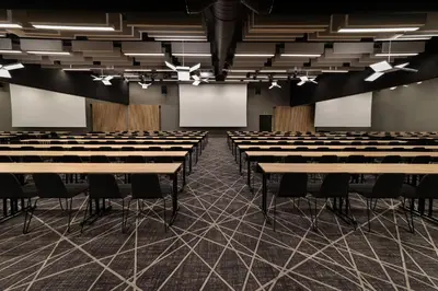 an empty room with rows of tables and chairs at Quality Hotel Sogndal in Sogndal