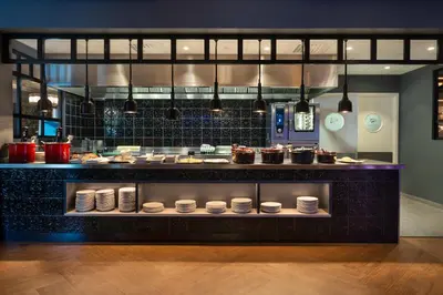 a kitchen with a counter with pots and pans at Quality Hotel Sogndal in Sogndal