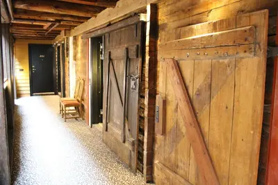 a barn door on the side of a house at Det Hanseatiske Hotel in Bergen