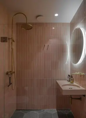a bathroom with a sink and a shower at Hotel 1904 in Ålesund