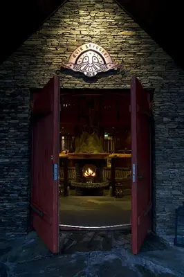 an open door of a brick building with a fireplace at Flåmsbrygga Hotel in Flåm