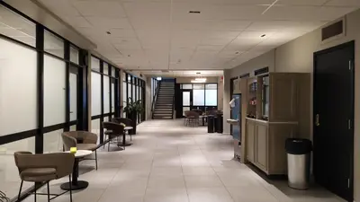 a hallway with chairs and tables in a building at Quality Hotel Augustin in Trondheim