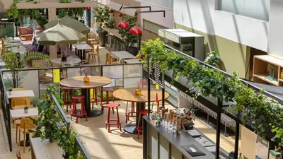 an overhead view of a restaurant with tables and plants at Comfort Hotel Trondheim in Trondheim