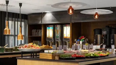a buffet line with different types of food on display at Comfort Hotel Trondheim in Trondheim